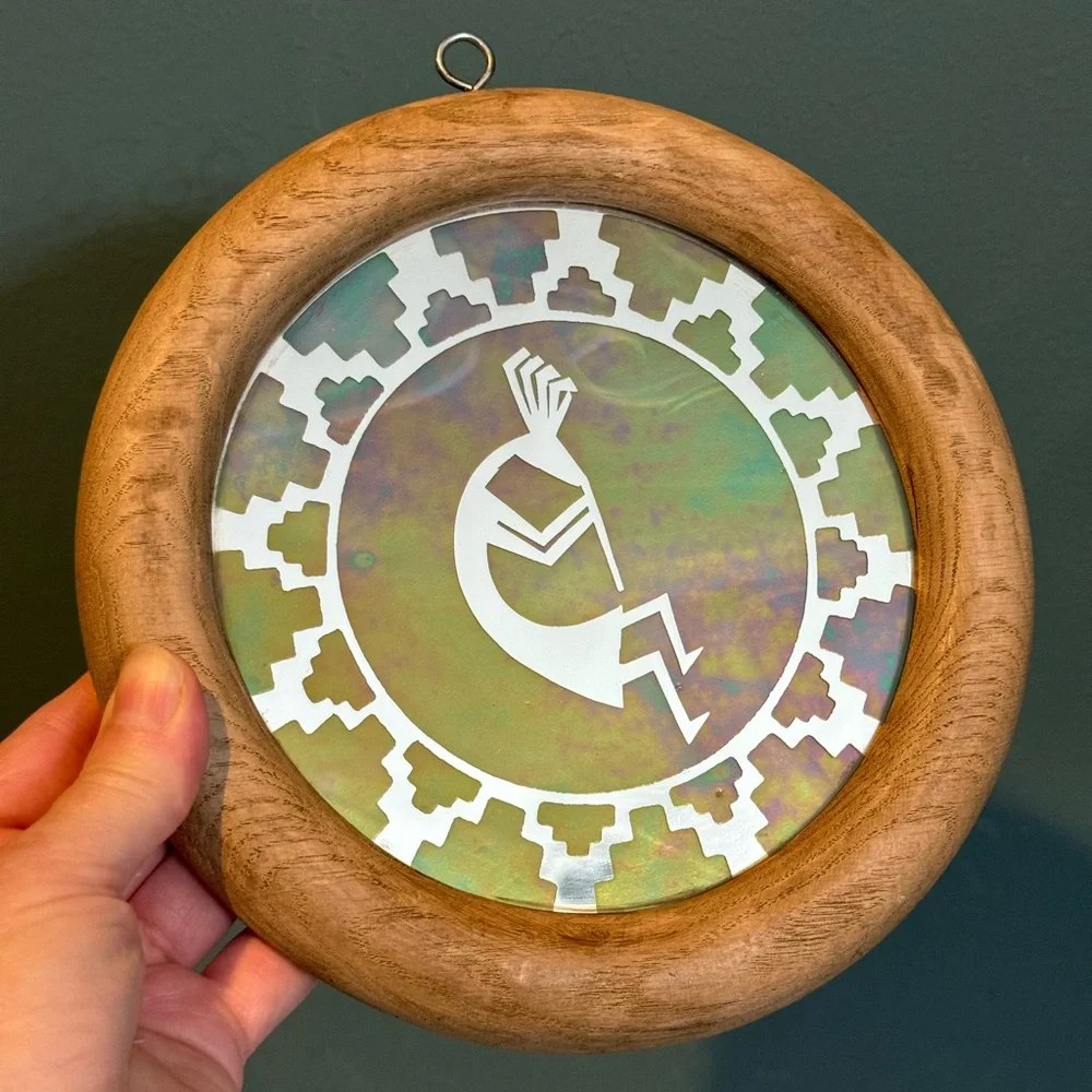 Kokopelli wall mirror with iridescent overlay in wooden frame - 7.75” diameter